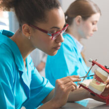 Dentist creating false teeth